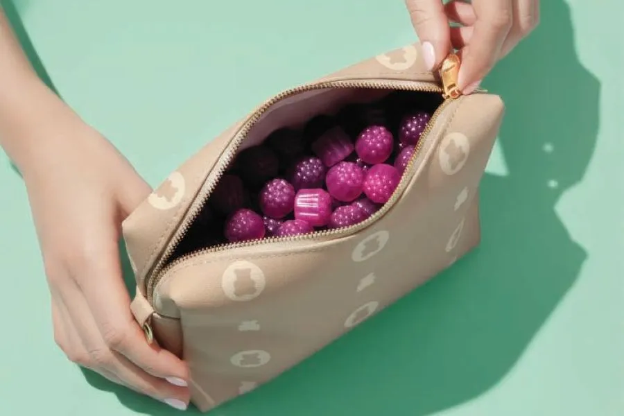 A makeup bag filled with gummies.
